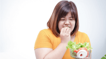 Women Eating Vegetables To Lose Weight